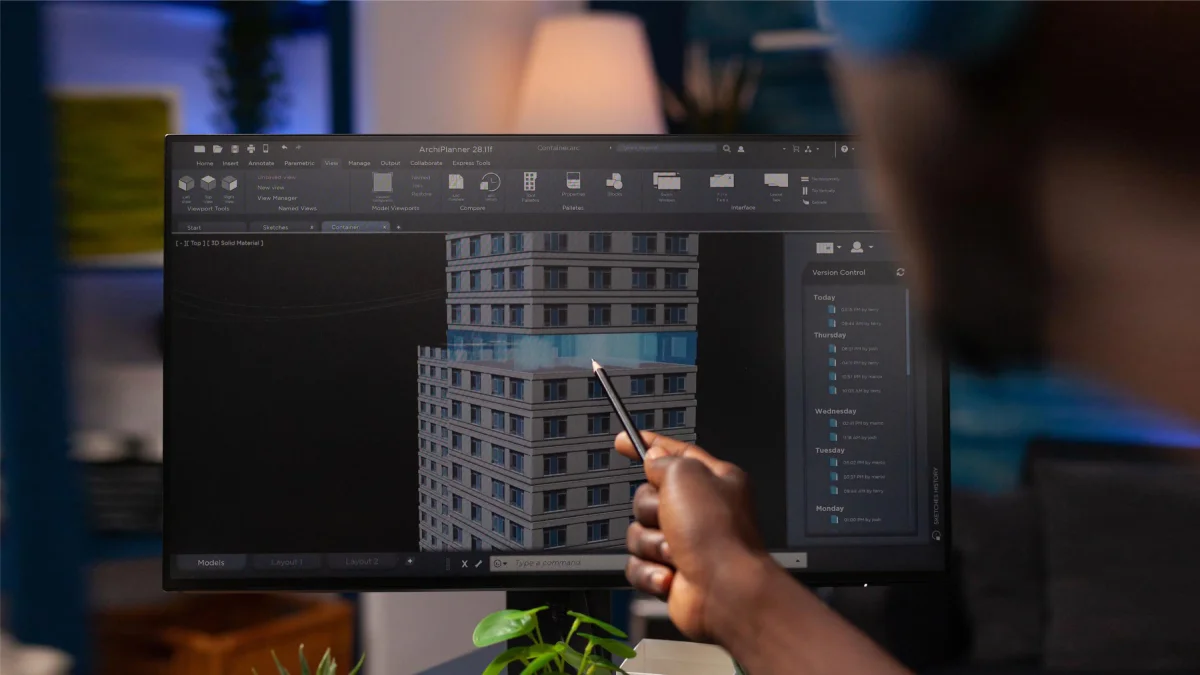 Professional 3D designer creating architectural models using advanced rendering software